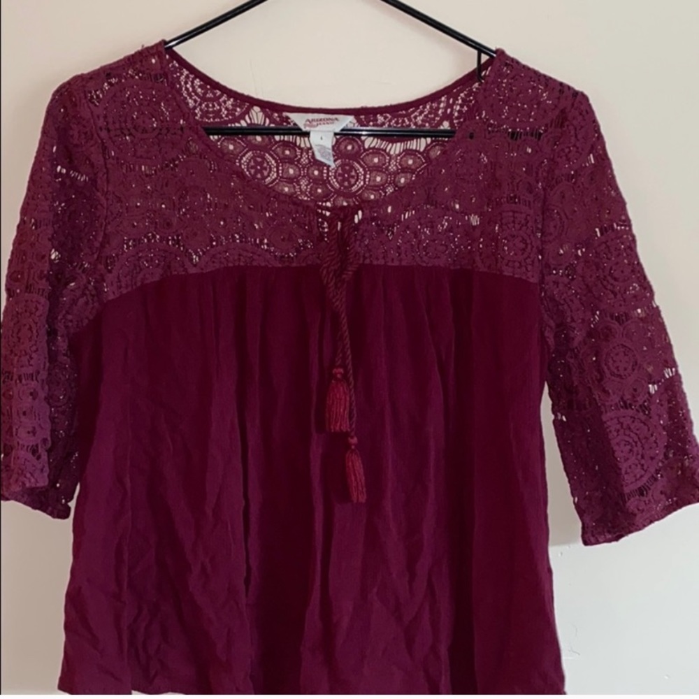 dark red blouse with tassles